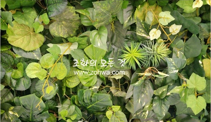 삼성동 네이처컬렉션 — 여러 종류의 잎이 섞인 벽면 질감